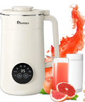 All In One Nut Milk Maker With 35 Oz Capacity, 10 Blades, One Touch Start, next to a splash of juice and grapefruit slices.