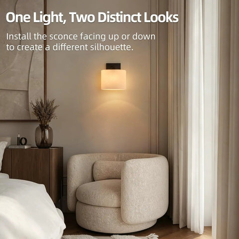 Modern Black Milk Glass Wall Sconces, 1 Pack Hardwired Wall Light Fixtures mounted beside a cozy chair in a stylish room.
