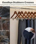 Heavy Duty Wooden Hangers With Clips 24 Pack Premium Walnut Wood Hangers With Adjustable Clips For Pants And Skirts, shows clothes hung neatly preventing creases.