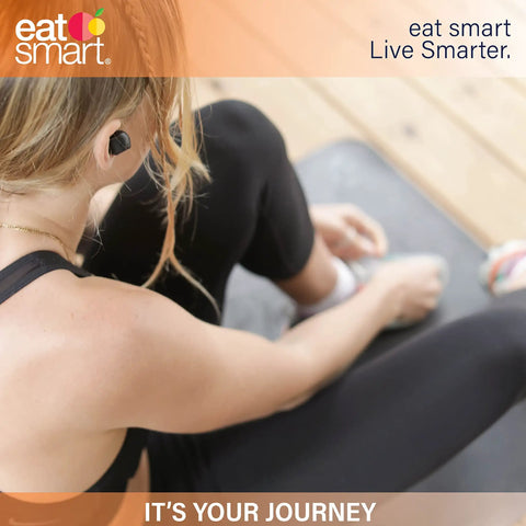 Person on yoga mat wearing earbuds preparing for workout, emphasizing the journey to wellness and fitness.