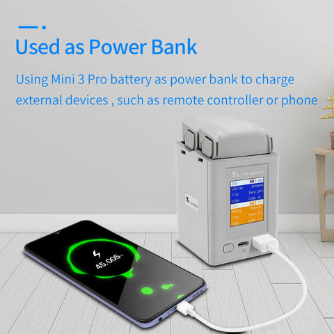 LCD Parallel Charger With Storage And Discharge For DJI Mini 4 Pro And Mini 3 Pro Batteries powering smartphone via USB power bank mode