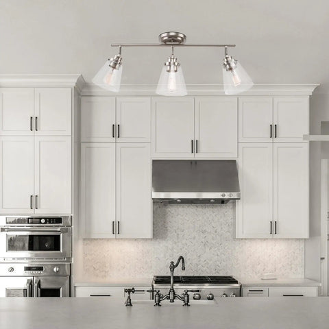 Mika 3 Light Track Lighting Kit In Matte Black With Clear Glass Shades above kitchen island, no bulbs, mid-century modern style