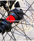 Complete Front And Rear Mechanical Disc Brake Kit With Heavy Duty Rotors And Precision Calipers Plus All Mounting Bolts For Mountain Bikes Gnarly Trail Ready Setup close-up of rotor and hub on mountain bike wheel.