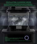 High Octane Oscillating Resin Print Washer For 3D Models Featuring Total No Sweat Four Minute Clean Cycle And Solid Performance With Top Shelf Solvent Bath Soak Station in oscillating cleaning mode with water swirling.