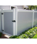 Dual Sided Lockable Magnetic Gate Latch Matte Black Zero Hassle Mounting On Wood Metal Vinyl Fence Posts on a gray vinyl fence.