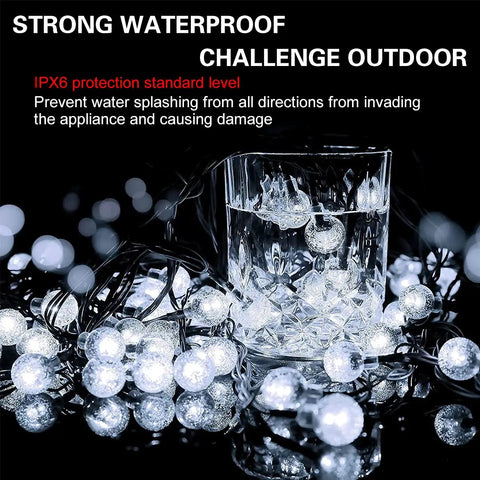Solar Powered String Lights With 200 LEDs, 72 ft Long, 8 Modes, Waterproof Crystal Globe Balls submerged in water displaying waterproof feature