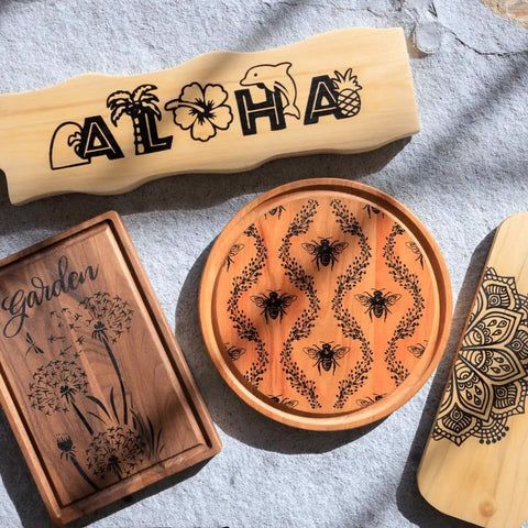 Various engraved wooden items on display showcasing the use of Wood Burning Marker Kit For Adults, No Soldering Needed, 2 In 1 Pyrography Tool.