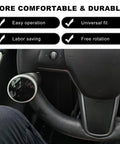 SHMZK steering wheel knob spinner with silver rim and black textured disk, installed on car steering wheel