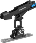 2 In 1 Kayak Fishing Rod Holder For Boats Track Mounted And Deck Mounted Universal Boat Rod Holder For Kayaks And Small Boats Keeps Your Rods Locked In While You Paddle Or Cast. Black plastic rod holder mounted on a kayak track, angled side view.
