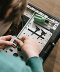 User installing Rock Solid Silicone Fan Mounting Screws Kit With Heavy Duty Anti Vibration Shock Absorbing Pins For PC Case Cooling Fans.