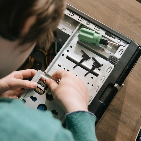 User installing Rock Solid Silicone Fan Mounting Screws Kit With Heavy Duty Anti Vibration Shock Absorbing Pins For PC Case Cooling Fans.