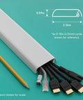 Slick Low Profile TV Wall Mount Cord Hider, Paintable Self Adhesive Cable Raceway with various cables, pencil for scale.