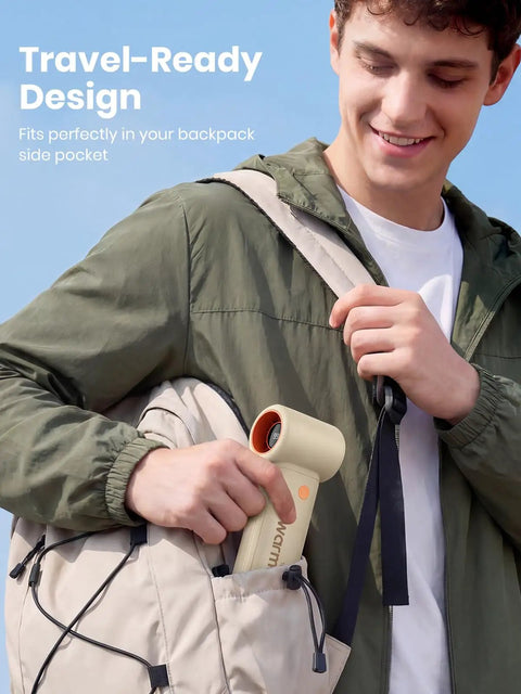 Man placing 10000mAh Portable Handheld Fan With USB Rechargeable Power Dope Mini Turbo Breeze into backpack pocket