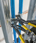 Using 10 Inch Quick Adjust Tongue And Groove Pliers with Push Button Ratchet on plumbing pipes in tight space