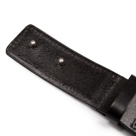 Close-up of black full-grain leather strap with metal pins from Scratchless Hidden Buckle Leather Work Belt For Tradesmen.