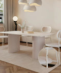 Modern dining room with white table and chairs, featuring close-up of 580 Piece Self Adhesive Screw Hole Stickers Set For Wooden Furniture And Cabinets, PVC Cover Caps Dustproof, 12mm 15mm 21mm, White, 6 Sheets, Easy Install For A Clean, Seamless Look applied to chair legs.