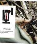 Hydraulic Hose Fitting Insert Tool For Bicycles With Needle Driver And Detachable Thimble Lock being used on bike chain
