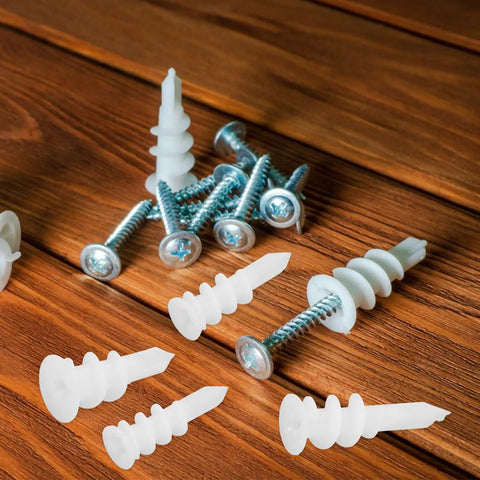 White Plastic Drywall Anchors Kit With 300 Pieces For Heavy Duty Drywall Repair And Installation, versatile sizes shown on wood surface