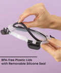 Hands holding BPA-free lid with silicone seal for 24Pc Borosilicate Glass Storage Containers With Lids For Meal Prep And Lunch.