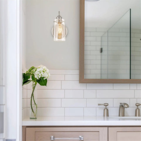 Kira Home Rayne 10" Modern Farmhouse Wall Sconce for Bathroom Vanity, Pack of 2, featuring clear glass shade in sleek bathroom setting.