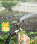 Brass Backflow Preventer Vacuum Breaker For Garden Hose With Anti Siphon Check Valve Three Quarters Inch Connection in use on a sprinkler