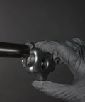 Person tightening a 5/16 Inch Threaded Knob Kit With Bolts And Washers, 4 Pack T Track Clamping Knobs on a black metal rod
