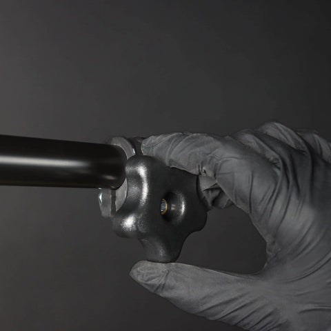 Person tightening a 5/16 Inch Threaded Knob Kit With Bolts And Washers, 4 Pack T Track Clamping Knobs on a black metal rod