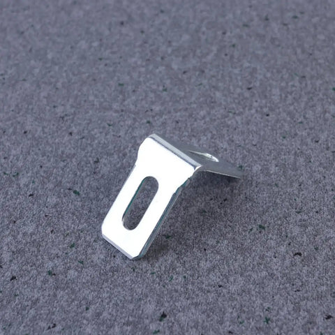 Close-up of a white plastic bracket from the 28 Pack White Plastic Corner Brackets For Furniture Reinforcement Anti Slip Desk And Chair Corner Braces