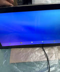 Heavy Duty 15.6 Inch Industrial Tablet Pc Featuring Tough As Nails Android Touchscreen showing a blue screen, placed on a table.