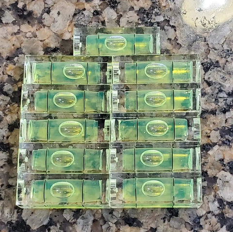 Eleven Piece Mini Picture Hanging Level Featuring Precision Spirit Bubble And Quick Measure Grids For Straight Up No Sweat Wall Art Framing Or Shelf Mounting Setup In Compact Green Pmma Design
