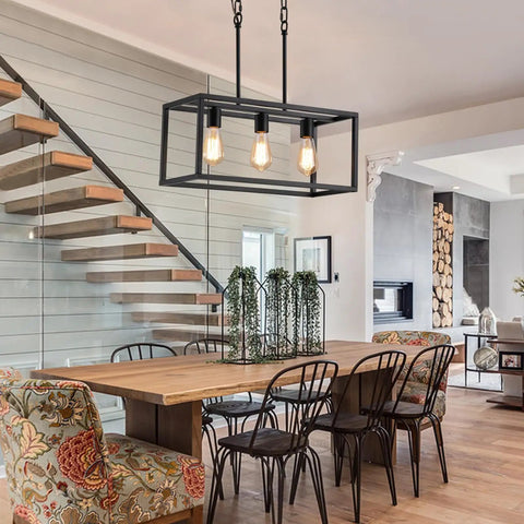 Three Light Black Linear Chandelier for Modern Dining Room and Kitchen Island Bar Rectangle Farmhouse Pendant Light Industrial Style Fixture with UL Listed hanging over a wooden dining table.