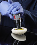 Person using Perfect-It Paint Finishing Pad Kit for Small Areas, 4 inch single sided, with foam and low-lint wool on car surface.