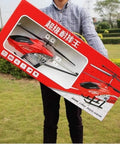 Red Large Fall Resistant RC Helicopter With Three Point Five Channels Remote Control LED Night Light Includes Two Batteries Gyro Stabilization For Smooth Flights Durable Alloy Frame Easy Operation For Beginners And Hobbyists box held outdoors