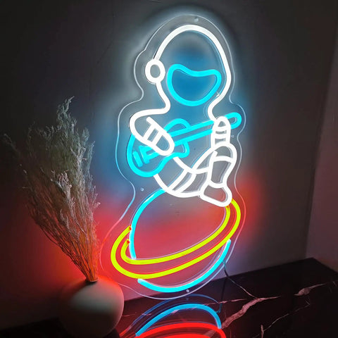Spacecraft Neon Sign LED Wall Light For Bedroom And Kids Room Decor with astronaut design on planet, glowing colors.