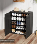All Weather 62 Gallon Resin Deck Box For Outdoors, Waterproof Storage Cabinet with shoes on shelves, black, on patio.