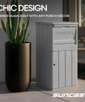 Secure Outdoor Parcel Drop Box With Lock For No Contact Front Porch Deliveries Weather Resistant 33 Gallon Package Storage For Secure Easy Retrieval By Owner Made In USA next to plant