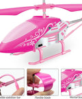 Close-up of Pink RC Helicopter For Kids And Beginners 2.4GHz 3.5 Channel Indoor Flight Toy with LED lights, showing parts detail.