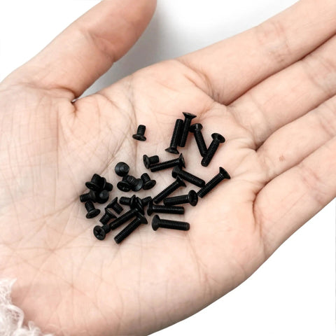 400 Piece Mini Flathead Phillips Screw Kit With 15 Sizes M1.7 To M3 Steel Zinc Coated For Electronics Eyeglasses Watches And Precision DIY Projects Ideal For Repairs And Small Hardware Fixes shown in a hand