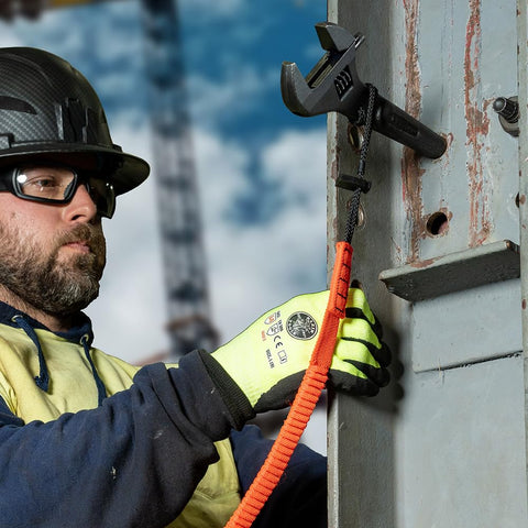 Heavy Duty Adjustable Spud Wrench 16 Inch Long With 1 5 8 Inch Opening Fits Heavy Nuts And Bolts Up To 1 Inch Forged In USA Tether Hole For Safe Work Lanyard Compatible Built For Tough Job Sites in use on construction site