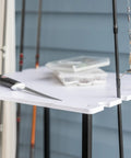 Garage Fishing Pole Organizer That Holds Ten Rods, Reels, Tackle Box, And Gear With Built In Shelves, close-up of shelf with gear