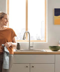 Kitchen featuring Precept Pull-Down Kitchen Faucet, 1.5 GPM Flow, Stainless Finish, 3-Function Sprayer With POWERinse in use