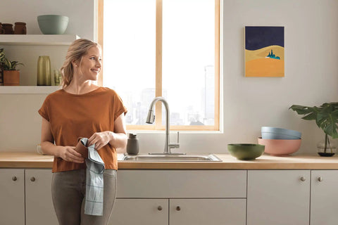 Kitchen featuring Precept Pull-Down Kitchen Faucet, 1.5 GPM Flow, Stainless Finish, 3-Function Sprayer With POWERinse in use