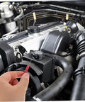 A hand using a 2 Pack Piercing Test Probes For Digital Multimeters And Wire Testers Pro Grade 0.7 mm Thick Probes With 2 mm Signal Needle Durable Circuit Testing Tool For Auto Repairs And Electronics Red in an engine bay for automotive diagnostics.