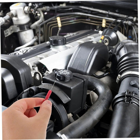 A hand using a 2 Pack Piercing Test Probes For Digital Multimeters And Wire Testers Pro Grade 0.7 mm Thick Probes With 2 mm Signal Needle Durable Circuit Testing Tool For Auto Repairs And Electronics Red in an engine bay for automotive diagnostics.