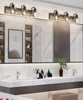 Three Light Matte Black Farmhouse Vanity Lighting Fixture With Clear Glass Globes for Bathroom over a modern double sink