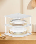Acrylic Corner Shelf Cabinet 3 Tier Plate Rack Storage Organizer for cups, dishes, and water glasses on a kitchen countertop.