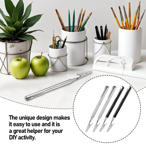 Stainless Steel Alligator Clips Set With Telescopic Wire Clamps and Pen Clip shown on a creative workspace table