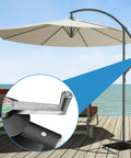 Cantilever Patio Umbrella Stand With Adjustable Rocking Handle And Stable Lock For Easy Raising And Lowering shown by the sea