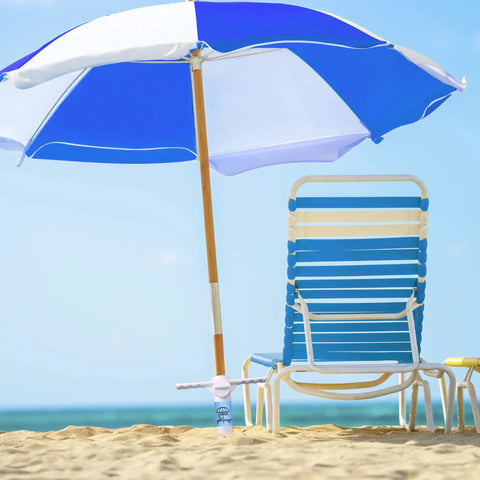 Beach Umbrella Sand Anchor Heavy Duty Base with 5 Spiral Screws Universal Fit for Most Beach Umbrellas Wind Resistant Holder Stand White Durable ABS Plastic That Wont Rust In Sand Or Salt Water securing umbrella on sunny beach.