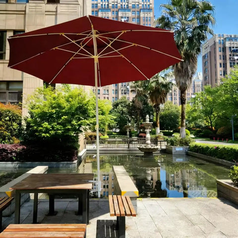 Heavy Duty Patio Umbrella Clamp In Rustproof Steel With 360 Degree Rotation Railing Holder For Balcony Fence Bleachers And Outdoor Deck Easy Install And Secure Grip in a park setting with red umbrella on patio benches by a pond.